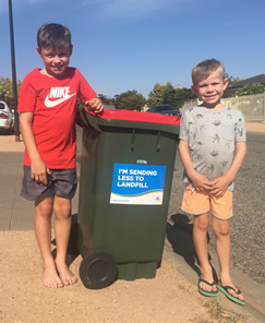 Port Pirie Take the Pledge boys in front of kerbside bin